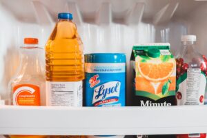 How to Deep Clean a Refrigerator Bottles with assorted juices in refrigerator