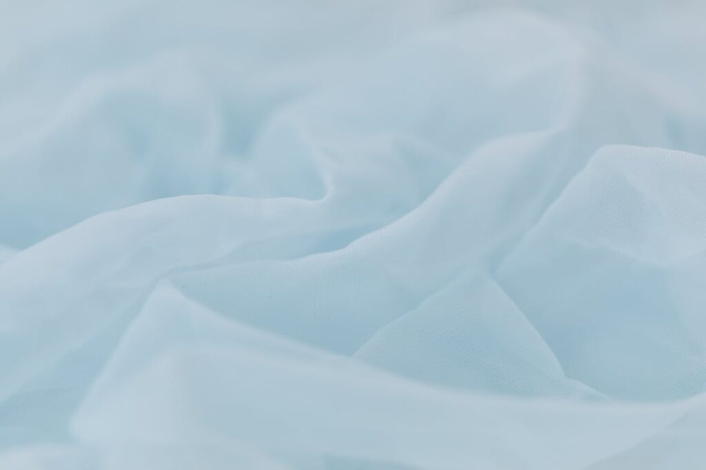 Baby Blue Textile in Close Up Photography