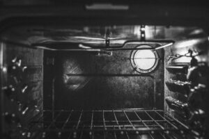 Black and white image of the inside of an oven